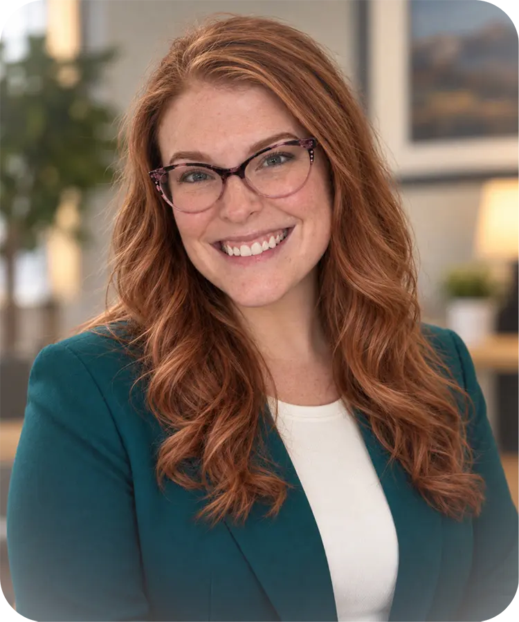 A professional headshot of a smiling woman